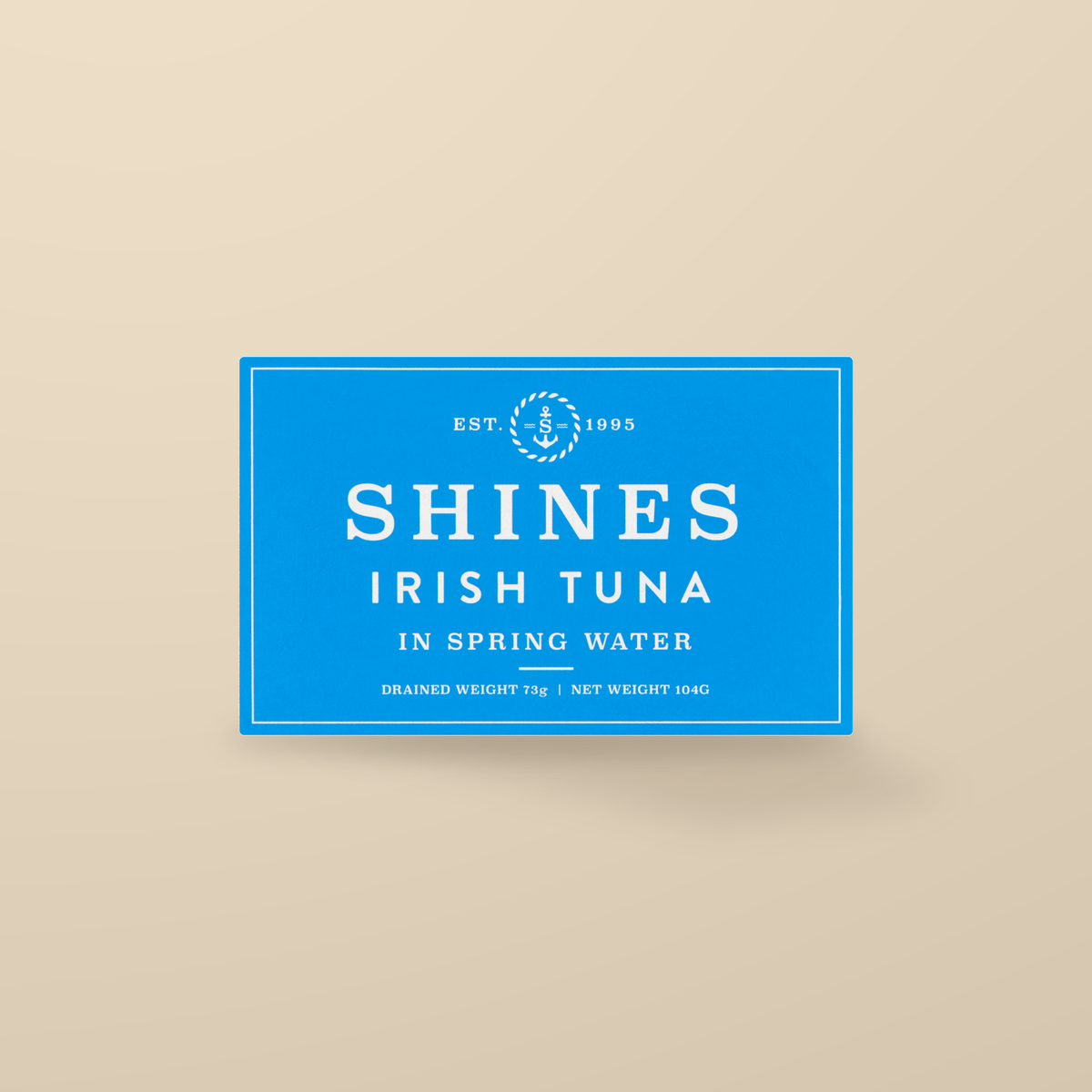 Shines Irish Albacore Tuna in Spring Water – 104g — original product packaging on warm beige background