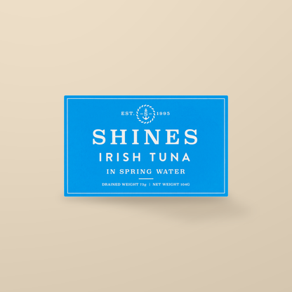 Shines Irish Albacore Tuna in Spring Water – 104g — original product packaging on warm beige background