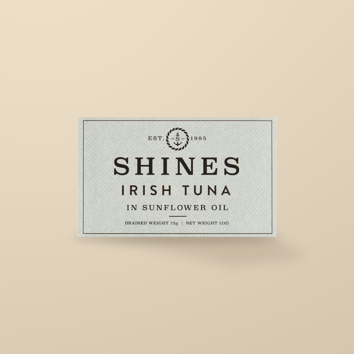 Shines Irish Albacore Tuna in Sunflower Oil – 111g — original product packaging on warm beige background