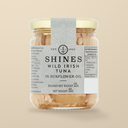 Shines Irish Albacore Tuna in Sunflower Oil – 185g — original product packaging on warm beige background