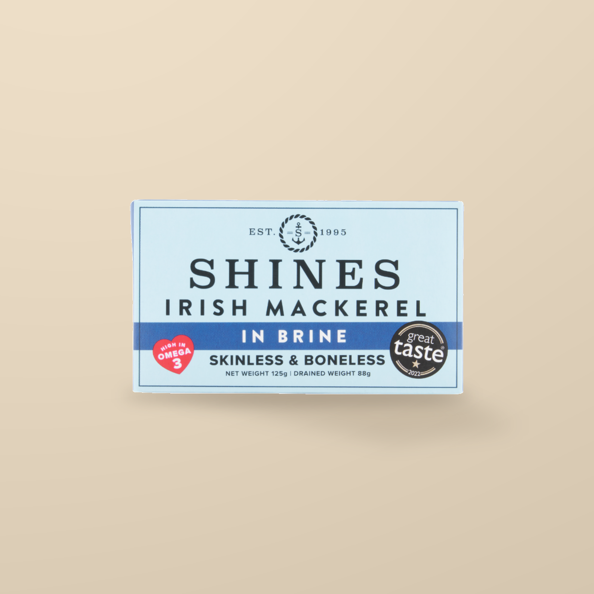 Shines Irish Mackerel Fillets in Brine – 125g — original product packaging on warm beige background