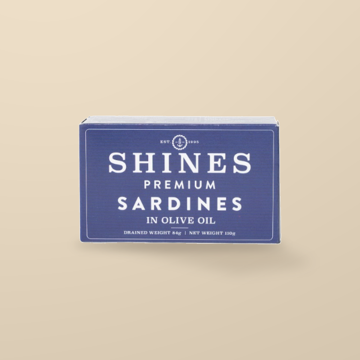 Shines Premium Sardines in Olive Oil – 118g — original product packaging on warm beige background