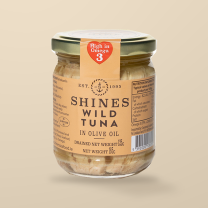 Shines Yellowfin Tuna in Olive Oil – 185g — original product packaging on warm beige background