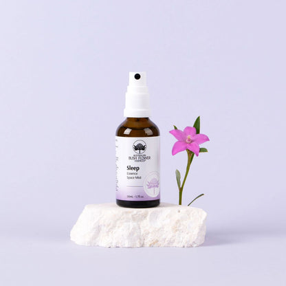Australian Bush Flower Sleep Mist 50ml beside a flower
