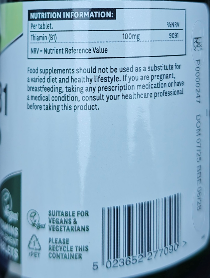 Nutrition label and warning text on a supplement container