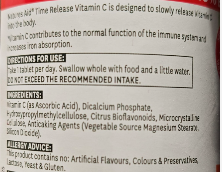 Vitamin C supplement label with directions for use and ingredients listed.