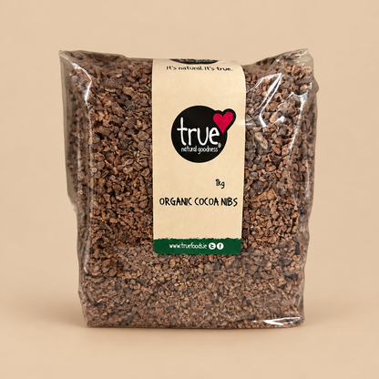 True Natural Goodness Organic Raw Cacao Nibs – 1kg product pack on beige background