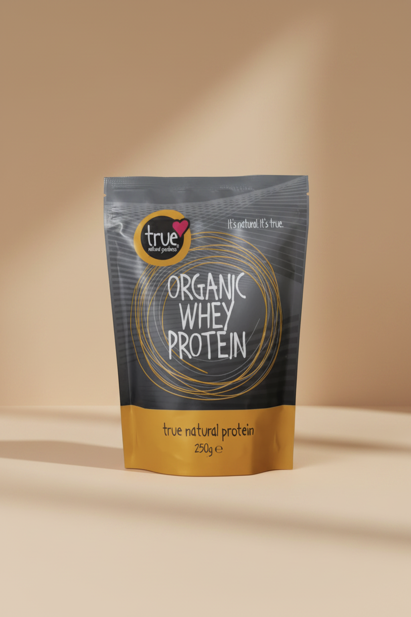 A 250g stand-up pouch of True Organic Whey Protein. The packaging features a dark gray top half with white text and gold circular line art, and a mustard yellow bottom band with black text.