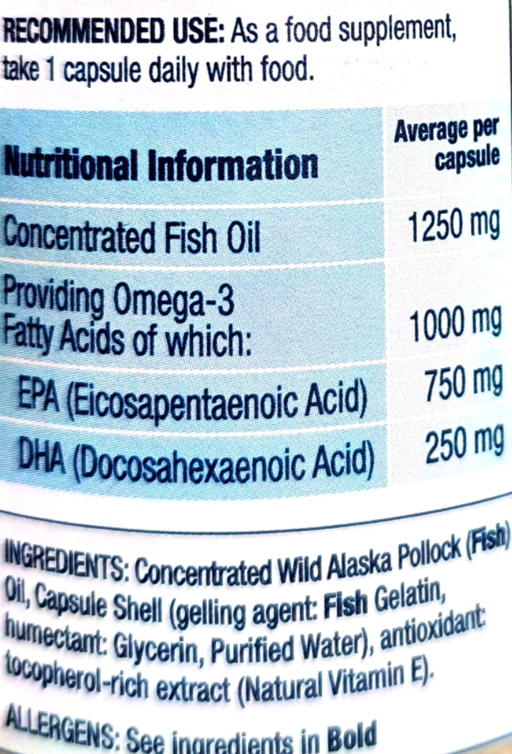 Close-up of a supplement label showing nutritional information and recommended use for a fish oil product.