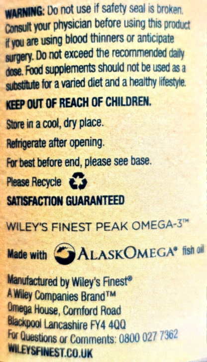 Back of a supplement package showing printed usage and recycling information in black text on a beige background, including warnings, storage instructions, and the Alaskan Omega fish oil branding.