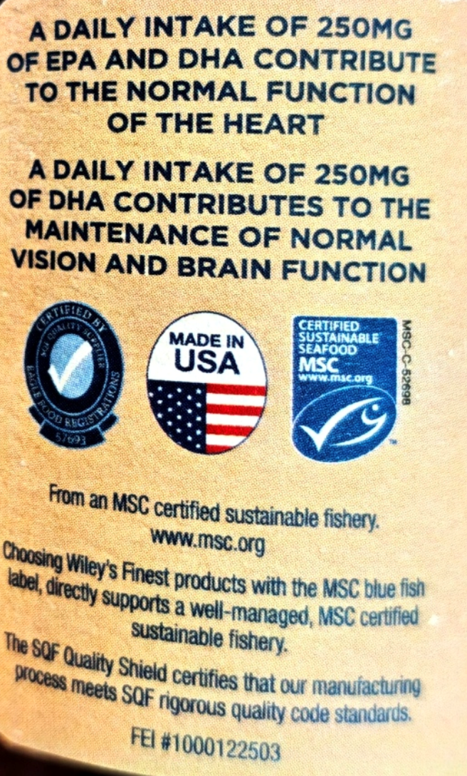 Close-up of the back of a Wiley product package showing blue text about EPA and DHA intake, along with certification logos including MSC and SQF Quality Shield.